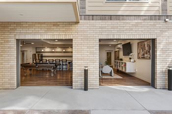 A modern house with a garage and a living room visible.